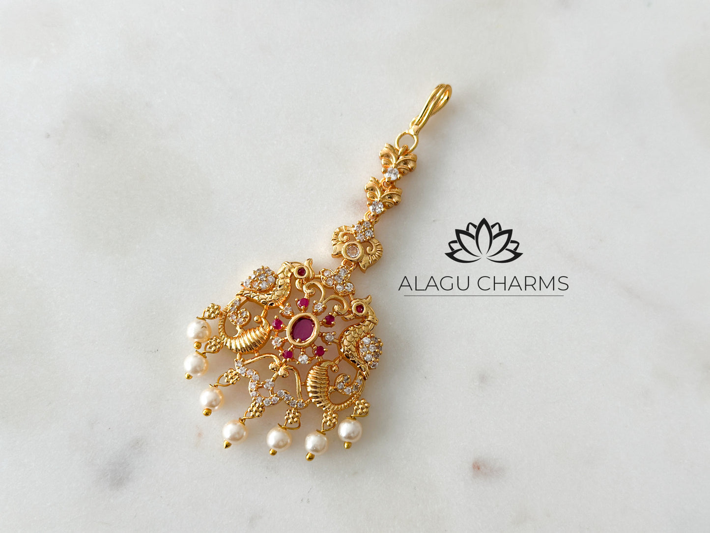 AD Tikka with peacock motif