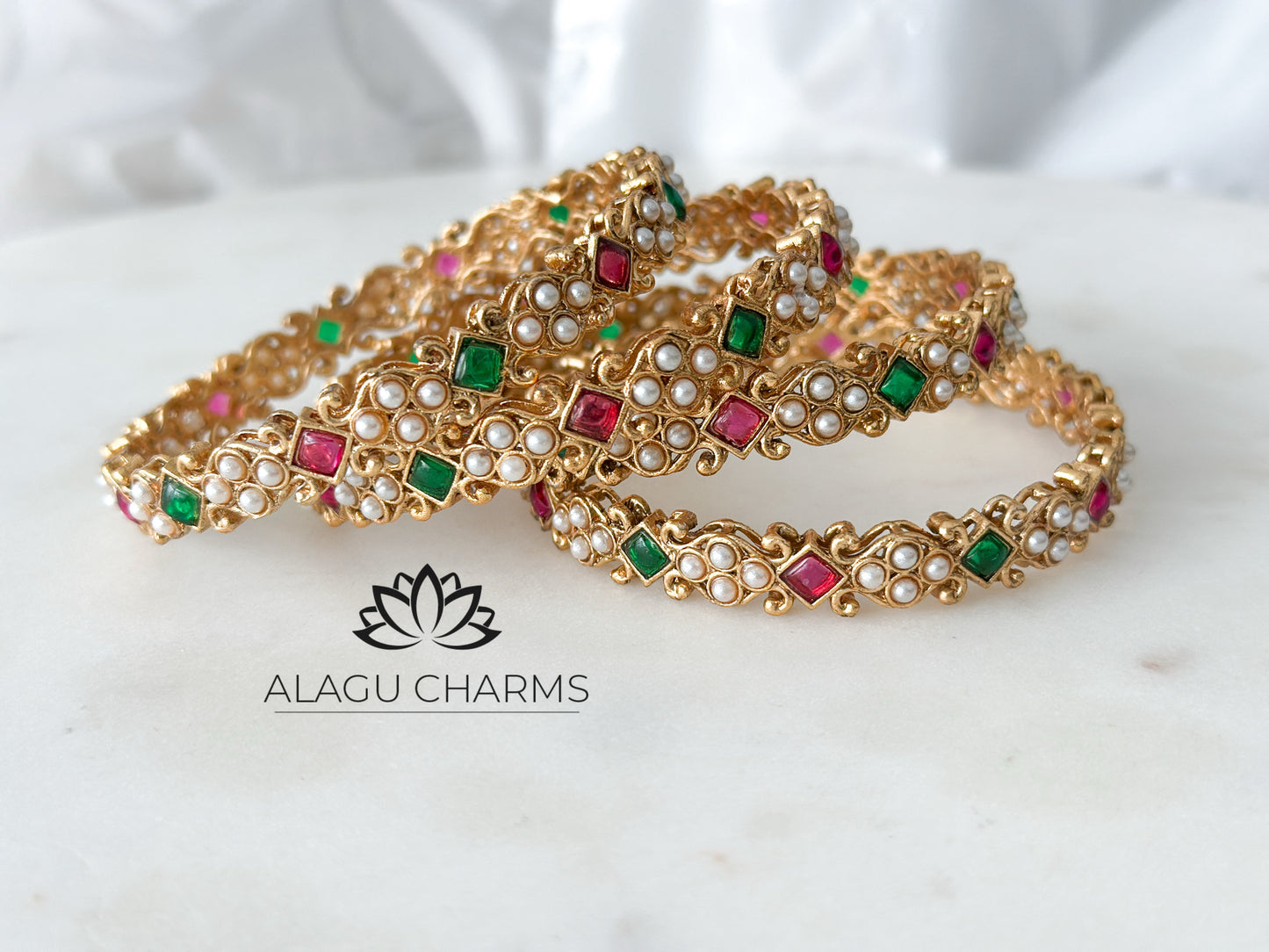 Statement bangles with red & green stones