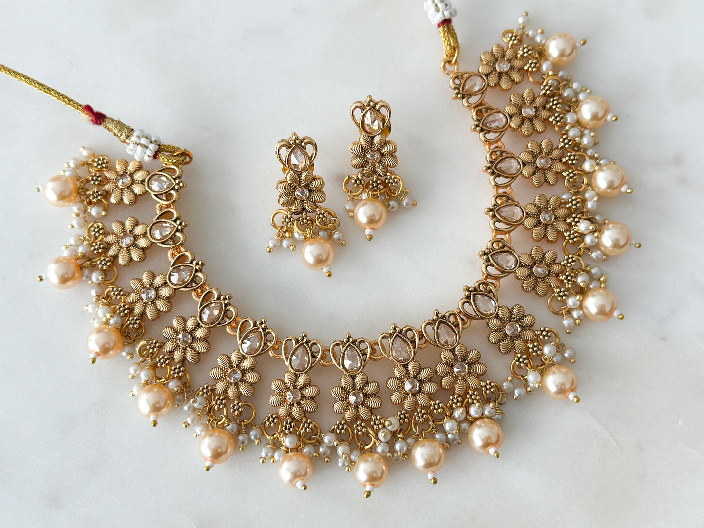 Mayuri- antique gold necklace set with Polki stones and champagne beads