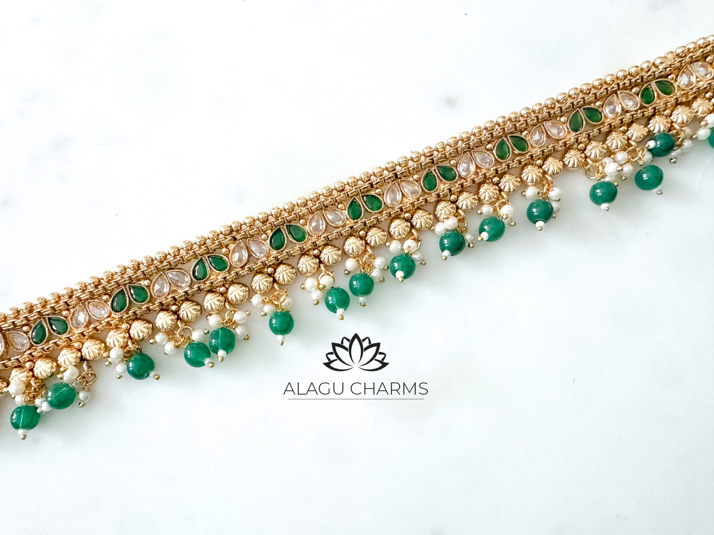 Aarthika- Gold waist chain with green pearls and stones