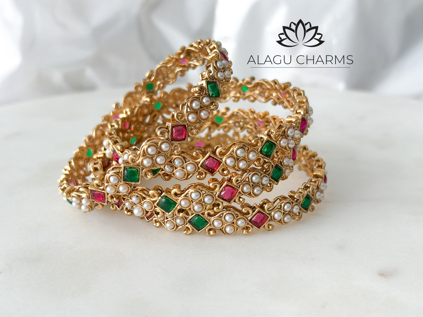 Statement bangles with red & green stones