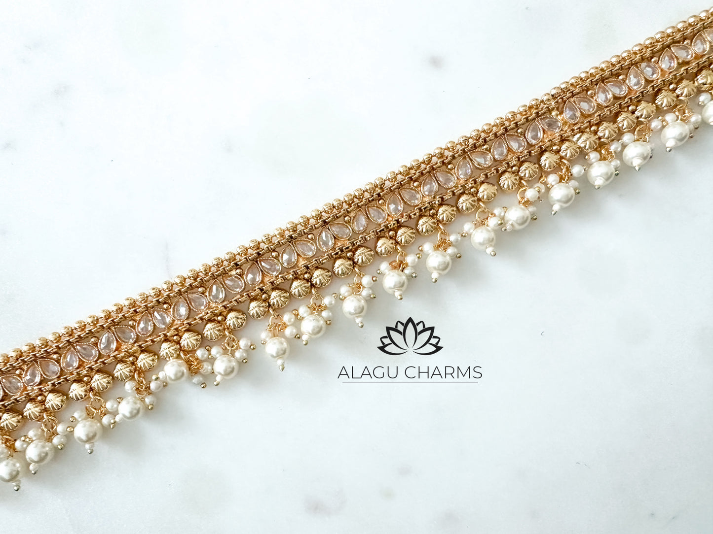 Aarthika- Gold waist chain with pearls and stones