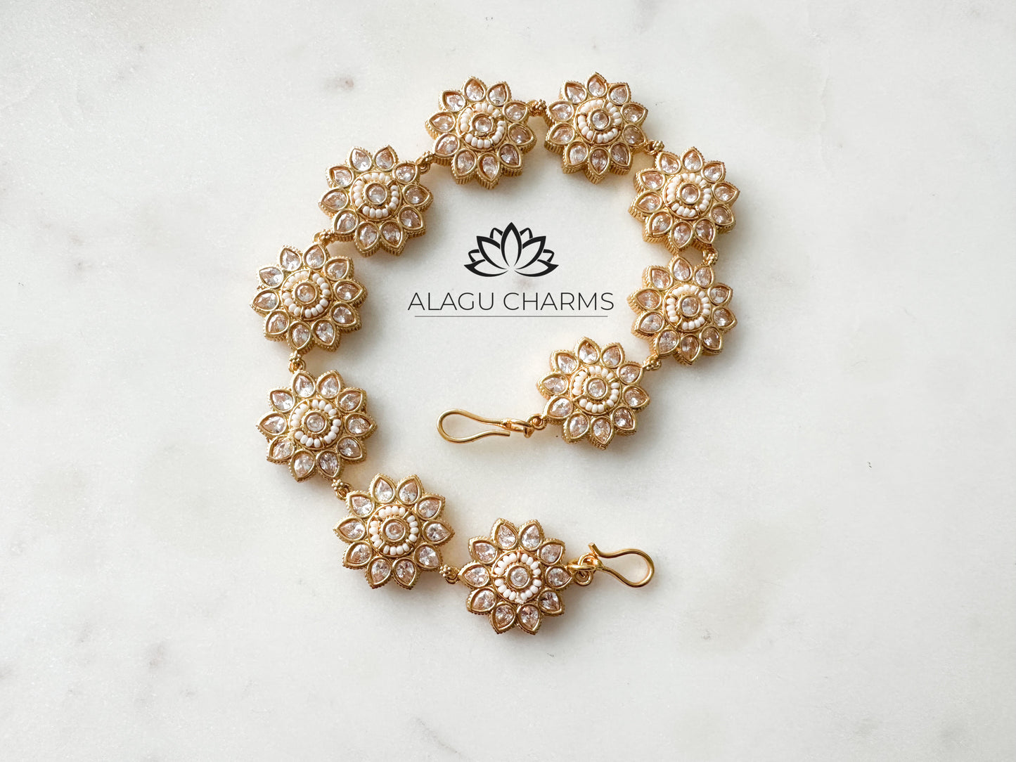 Gold hair band / accessories with clear stones and floral motifs