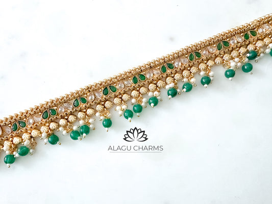 Aarthika- Gold waist chain with green pearls and stones
