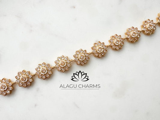 Gold hair band / accessories with clear stones and floral motifs