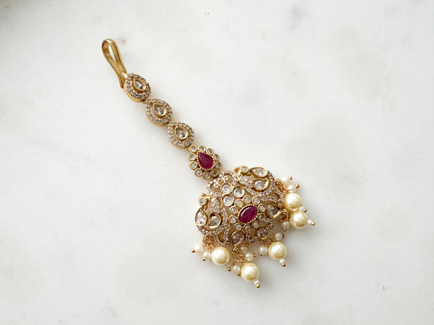 Tikka with clear and ruby stones