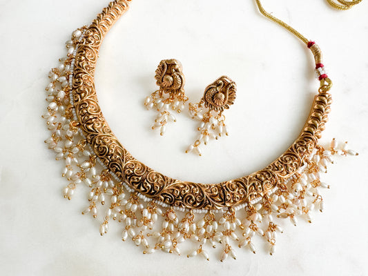 Kasthuri- antique gold necklace with dangling pearls