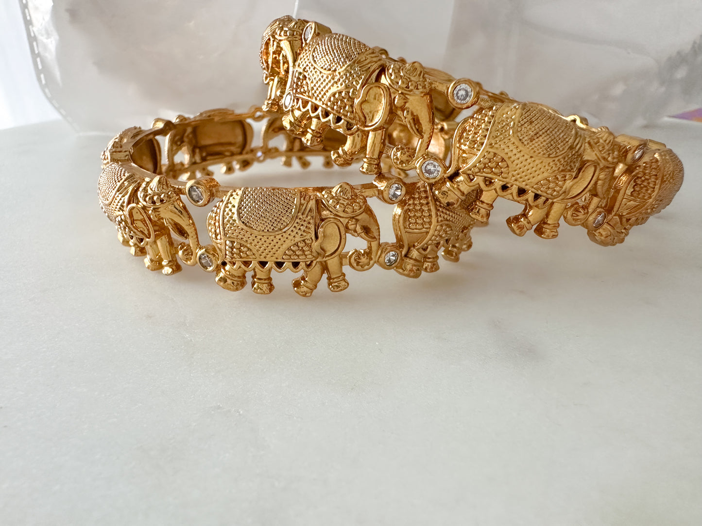 Statement temple bangles with elephant motifs