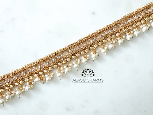 Aarthika- Gold waist chain with pearls and stones