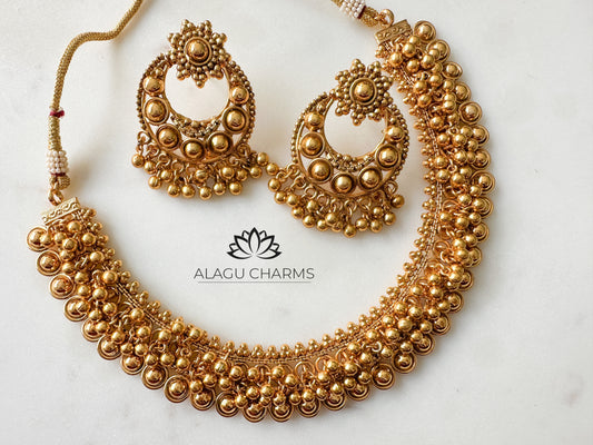 Antique gold necklace and earrings with gold beads