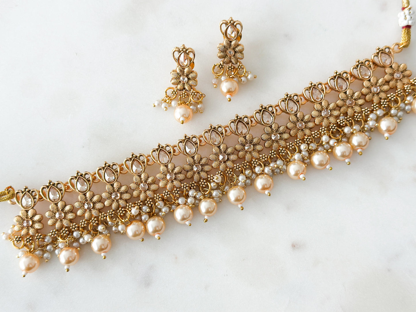 Mayuri- antique gold necklace set with Polki stones and champagne beads