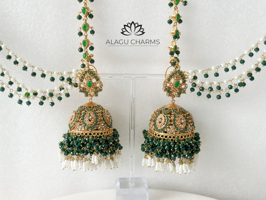 Delicate Pakistani-style gold-tone jhumka earrings featuring intricate filigree work and a matching ear chain, elegantly draped for a traditional and ornate bridal look. Pakistani jhumka