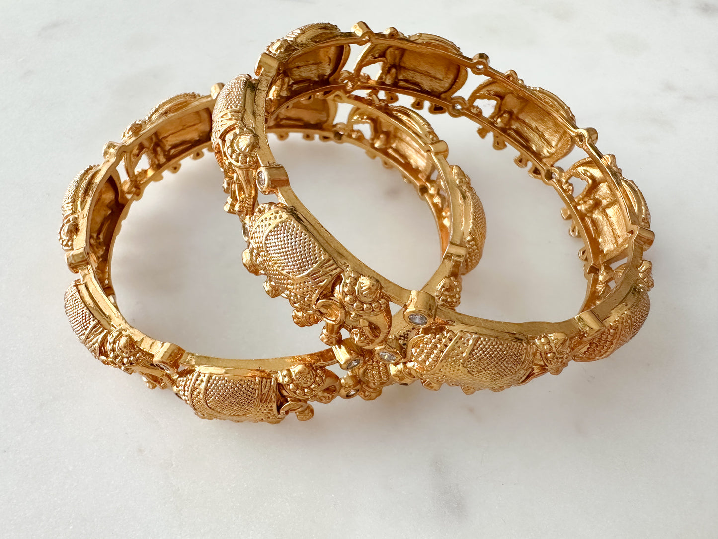 Statement temple bangles with elephant motifs